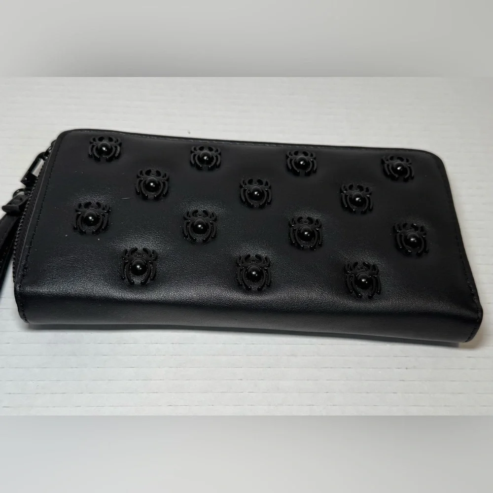 Betsey Johnson black faux leather zip-around wristlet/wallet